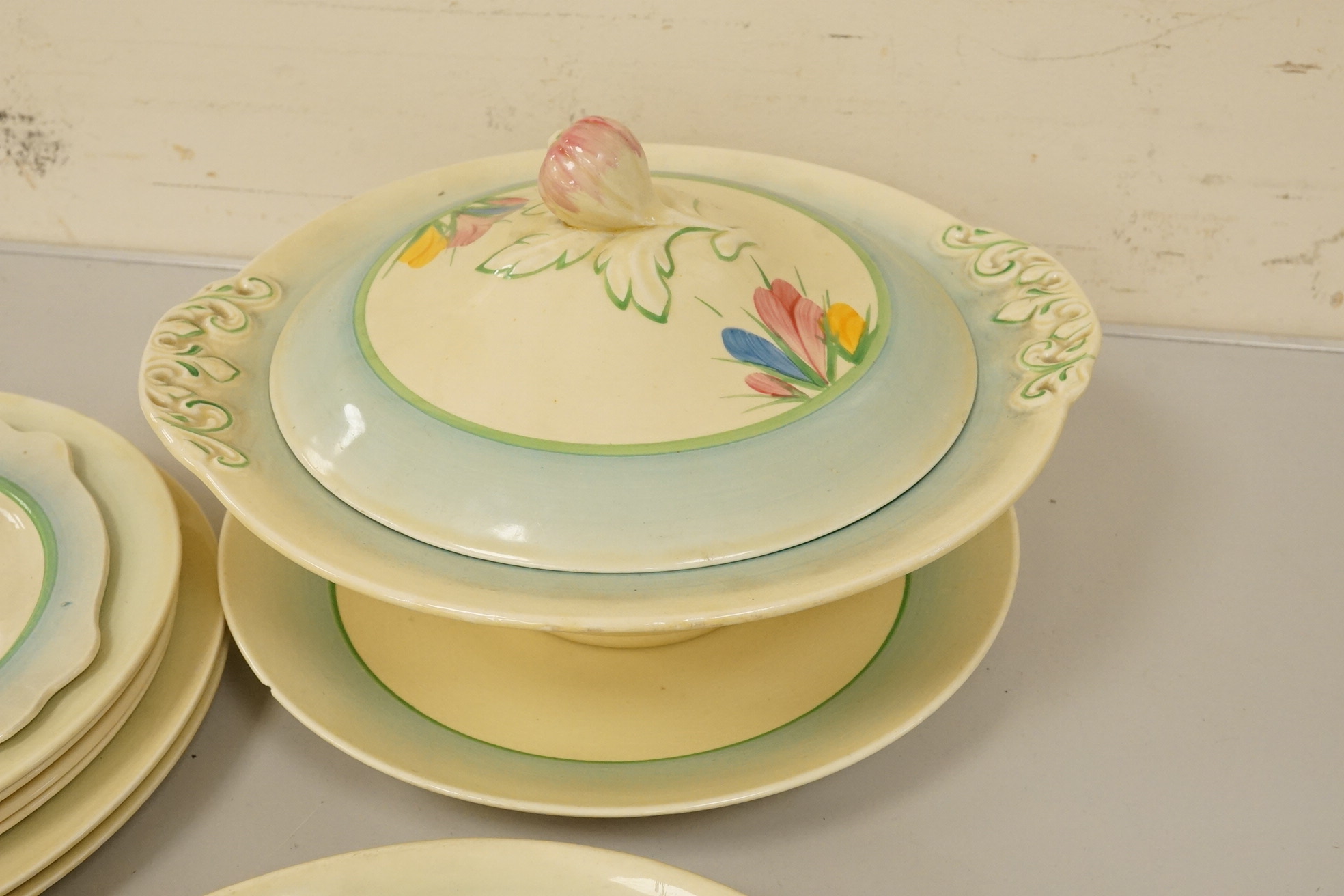 A collection of Clarice Cliff, Newport Pottery and Spring Crocus pattern tableware